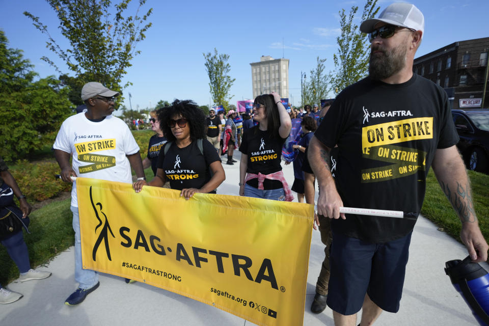 SAG-AFTRA members walk in the Labor Day parade in Detroit, Monday, Sept. 4, 2023. (AP Photo/Paul Sancya)