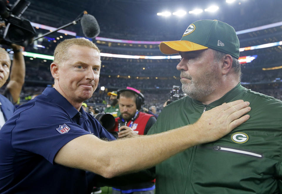 FILE - In this Jan. 15, 2017, file photo, Dallas Cowboys coach Jason Garrett, left, congratulates Green Bay Packers coach Mike McCarthy after their 34-31 win in an NFL divisional playoff football game in Arlington, Texas. For decades, dating back to Lombardi and Landry, the Packers against the Cowboys has been one of the NFL's juiciest rivalries. It got some extra spice in the playoffs last January. On Sunday, they meet again.  (AP Photo/Tony Gutierrez, File)