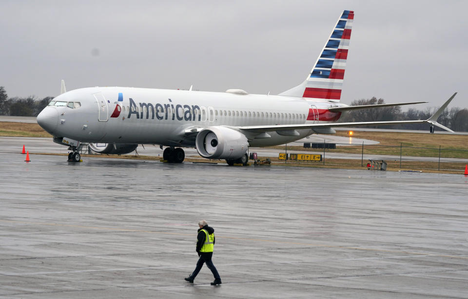 An American Airlines Boeing 737 Max jet plane is parked at a maintenance facility in Tulsa, Okla., Wednesday, Dec. 2, 2020. American Airlines took its long-grounded Boeing 737 Max jets out of storage, updating key flight-control software, and flying the planes in preparation for the first flights with paying passengers later this month. (AP Photo/LM Otero)