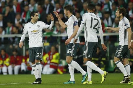 Soccer Football - Saint-Etienne v Manchester United - UEFA Europa League Round of 32 Second Leg - Stade Geoffroy-Guichard, Saint-Etienne, France - 22/2/17 Manchester United's Henrikh Mkhitaryan celebrates scoring their first goal with Michael Carrick Action Images via Reuters / Andrew Boyers Livepic