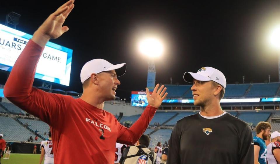 JACKSONVILLE, FLORIDA - AUGUST 29: Matt Ryan #2 of the Atlanta Falcons (L) speaks with Nick Foles #7 of the Jacksonville Jaguars following  a preseason game at TIAA Bank Field on August 29, 2019 in Jacksonville, Florida. (Photo by Sam Greenwood/Getty Images)