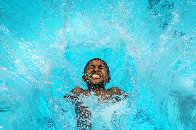 Reuben Hurst, 13, jumps into Charlton Lido in south London 