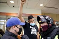 Demonstrators confront police following an officer-involved killing in Brooklyn Center, Minnesota