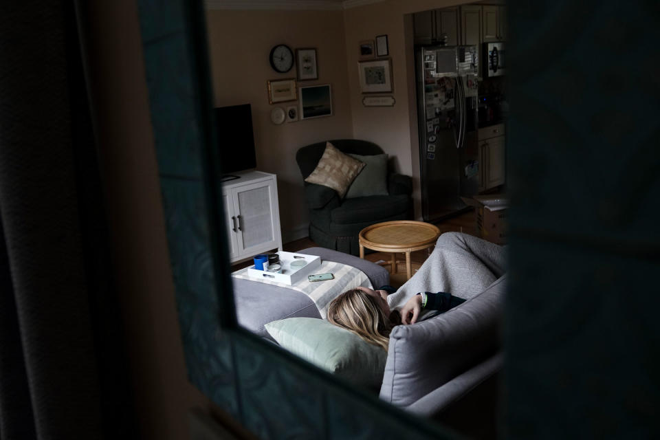 Eve Efron, who has been struggling with Long COVID for nearly a year, frequently has to rest on the couch in her home in Fairfax, VA on Feb. 3, 2022.<span class="copyright">Carolyn Van Houten—The Washington Post/Getty Images</span>