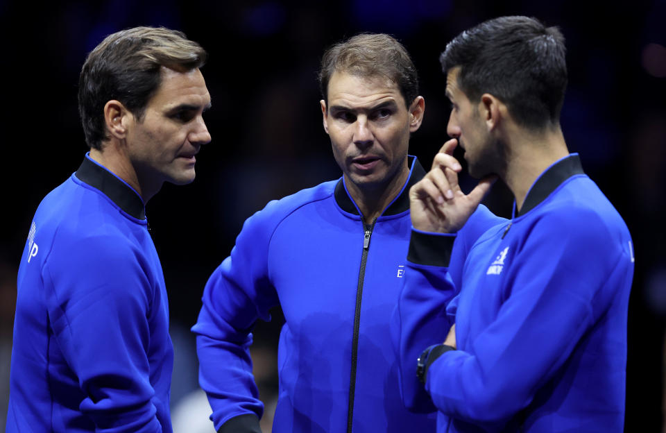 LONDON, ENGLAND - SEPTEMBER 23: Roger Federer, Rafael Nadal and Novak Djokovic of Team Europe talk on centre court during Day One of the Laver Cup at The O2 Arena on September 23, 2022 in London, England. (Photo by Julian Finney/Getty Images for Laver Cup)