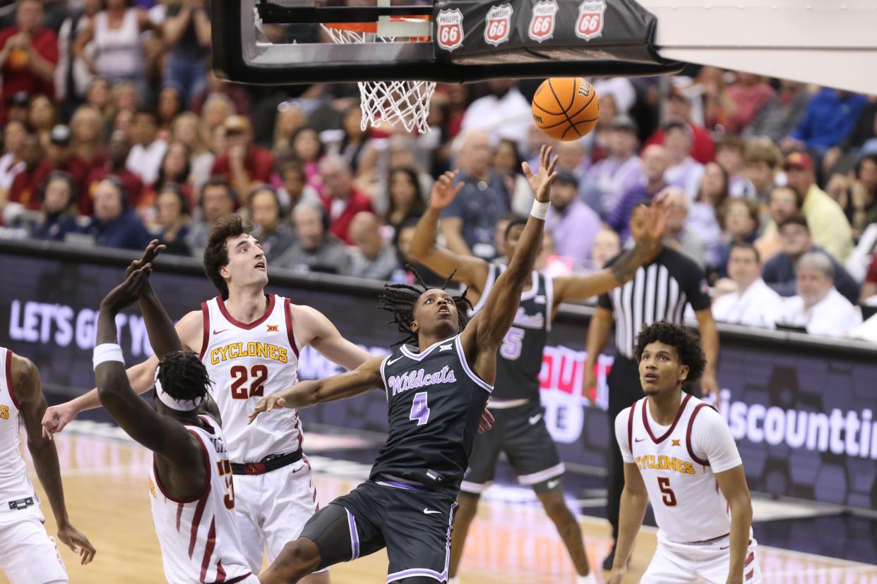 Kansas State guard Dai Dai Ames (4) drives for a layup against Iowa State in their Big 12 Tournament quarterfinal at T-Mobile Center in Kansas City, Mo.