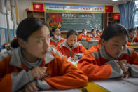 Students recite vocabulary during a Mandarin Chinese class at Nagqu No. 2 Senior High School, a public boarding school for students from northern Tibet, in Lhasa in western China's Tibet Autonomous Region, as seen during a rare government-led tour of the region for foreign journalists, Tuesday, June 1, 2021. Long defined by its Buddhist culture, Tibet is facing a push for assimilation and political orthodoxy under China's ruling Communist Party. (AP Photo/Mark Schiefelbein)