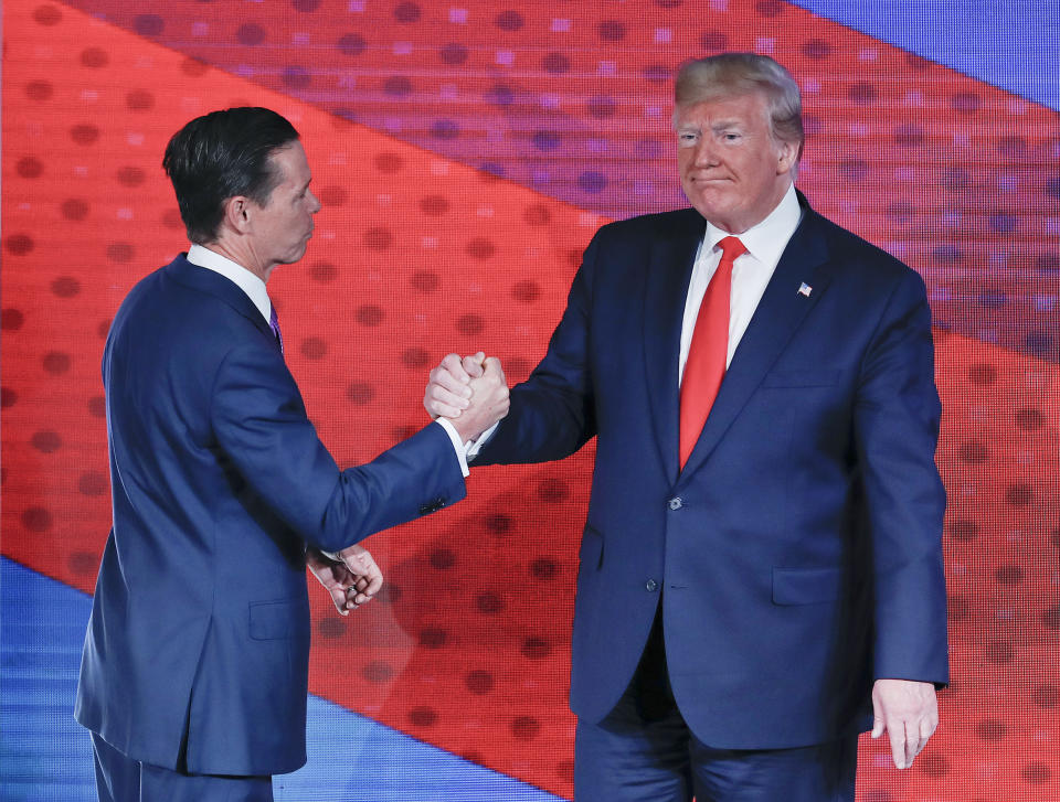 President Donald Trump, right, greets Ralph Reed, left, founder and chairman of the Faith & Freedom Coalition, before speaking at the Faith & Freedom Coalition conference in Washington, Wednesday, June 26, 2019. (AP Photo/Pablo Martinez Monsivais)