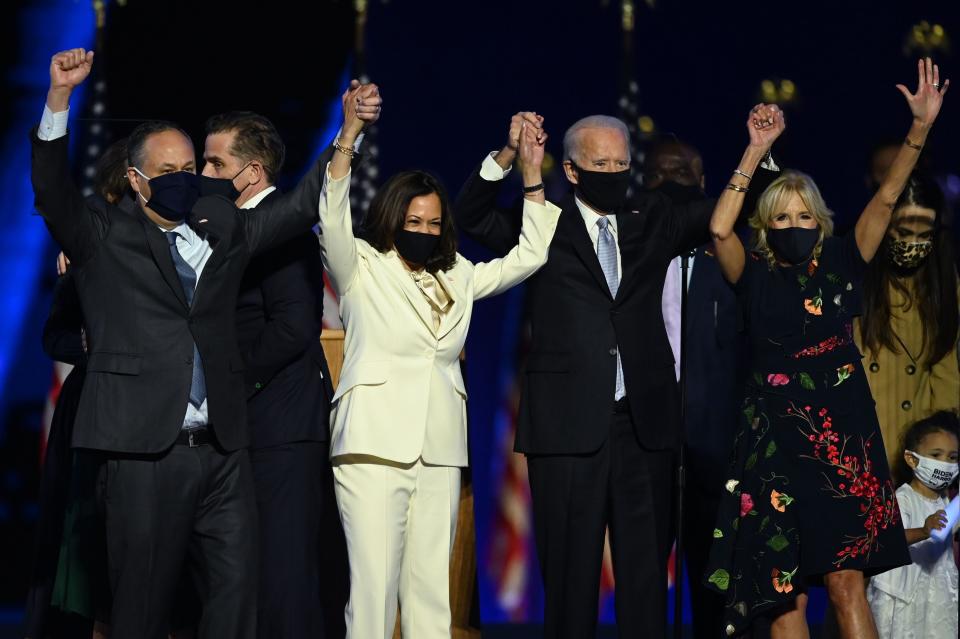 President-elect Joe Biden and Vice President-elect Kamala Harris stand with spouses Doug Emhoff and Jill Biden.