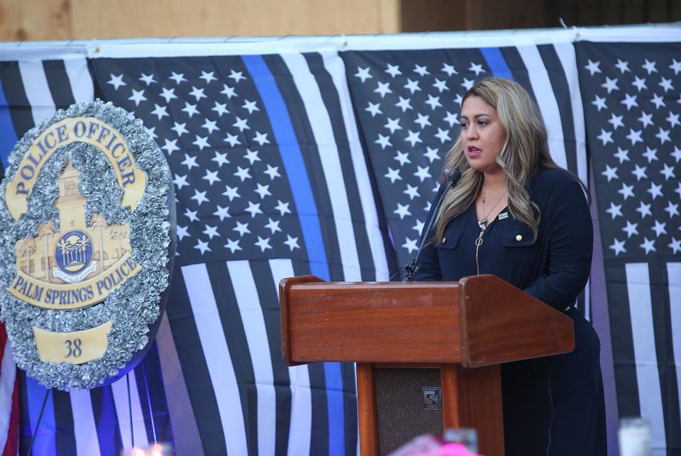 Gloria Vega speaks during a vigil for her father Jose "Gil" Vega and Lesley Zerebny at the Palm Springs Police Department commemorating the two-year anniversary of their passing, October 8, 2018.