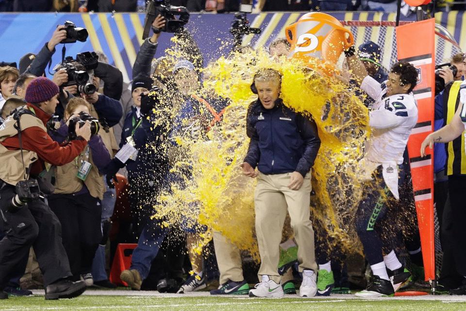Seattle Seahawks head coach Pete Carroll is doused with Gatorade late in the second half of the NFL Super Bowl XLVIII football game Sunday, Feb. 2, 2014, in East Rutherford, N.J. The Seahawks won 43-8. (AP Photo/Julio Cortez)