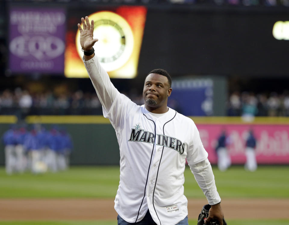 FILE - Former Seattle Mariners outfielder Ken Griffey Jr. waves to fans after being introduced before a baseball game against the Texas Rangers in Seattle, in this Friday, April 14, 2017, file photo. Hall of Famer Ken Griffey Jr. is investing in the Seattle Mariners in a way he never has before. He’ll be part of the ownership going forward. The Mariners announced Monday, Oct. 25, 2021, that their most famous former player has also become the first one to purchase a stake in the ball club. (AP Photo/Elaine Thompson, File)