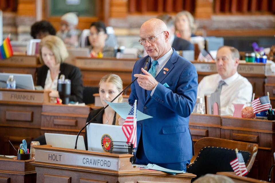 State Rep. Steven Holt, R-Denison, speaks from the House floor at the Iowa State Capitol, Monday, May 1, 2023.