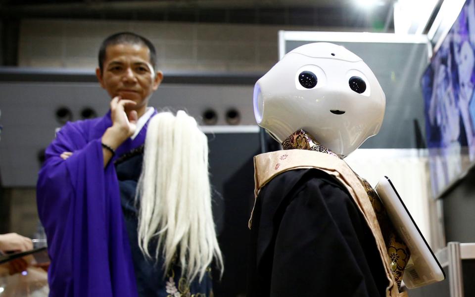 Pepper the robot priest and a Buddhist monk in Japan - REUTERS