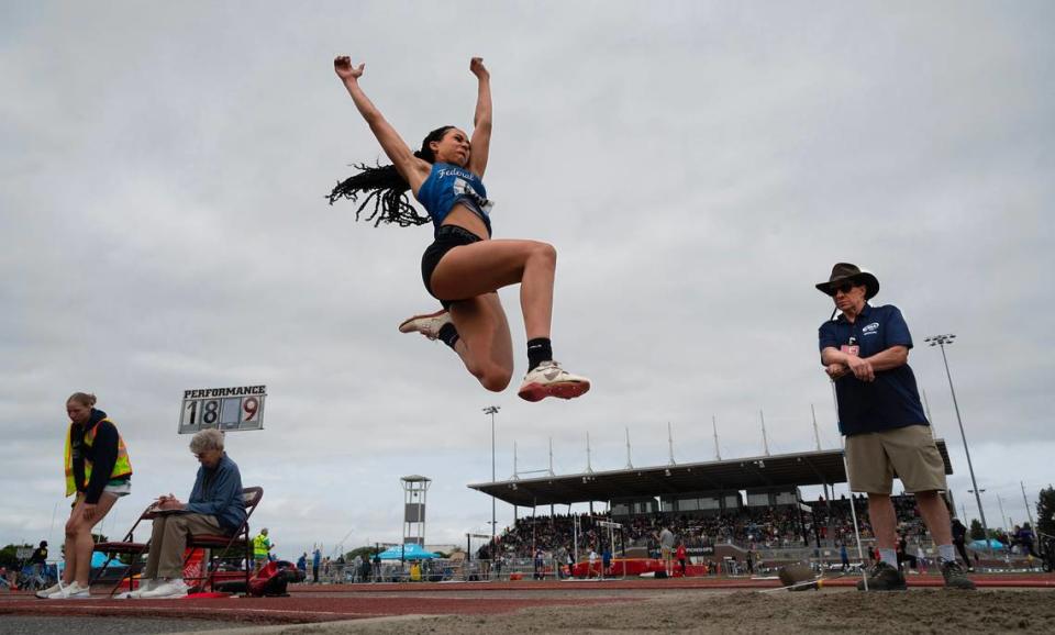Federal Way’s Cassandra Atkins sets sail en route to a state title in the 4A girls long jump competition during the final day of the WIAA state track and field championships at Mount Tahoma High School in Tacoma, Washington, on Friday, May 26, 2023.