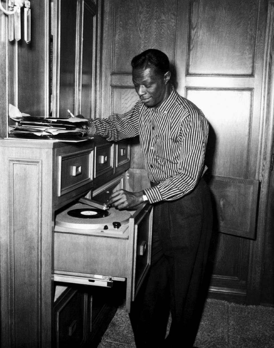 <p>The jazz singer combs through his record collection and picks out a good one for guests in his home. </p>