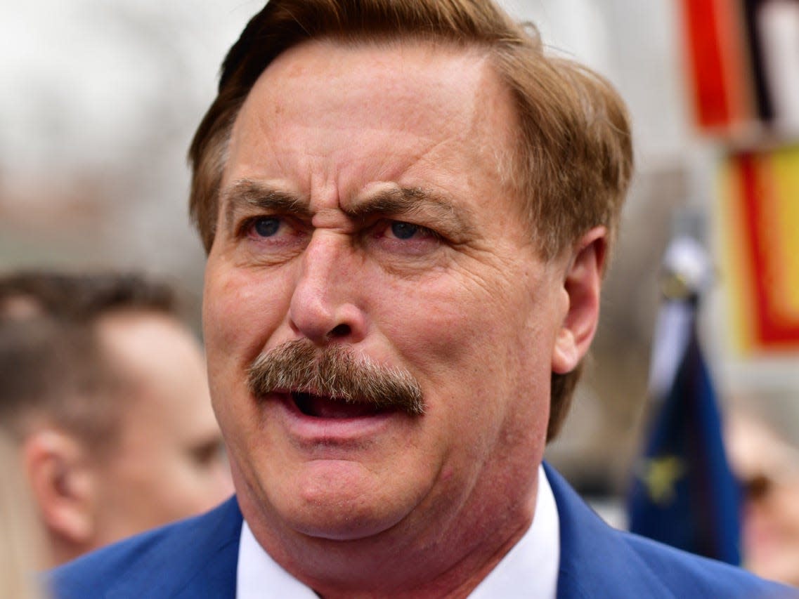 A headshot of Mike Lindell, the CEO of MyPillow, standing in a rally at the Colorado State Capitol building.