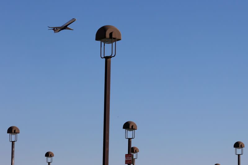 An airplane flies over Hartsfield–Jackson Atlanta International Airport in Atlanta