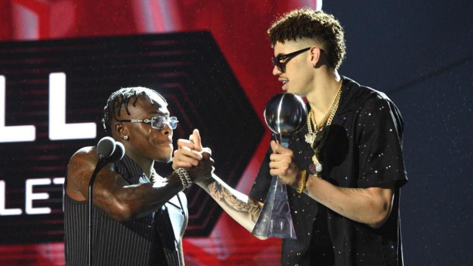 DaBaby presents the Best Breakthrough Athlete Award to Charlotte Hornets star LaMelo Ball onstage during the 2021 ESPY Awards.