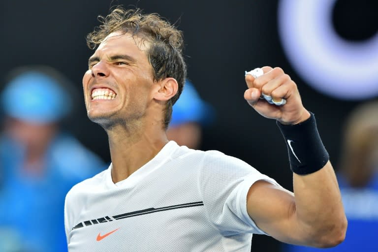 Spain's Rafael Nadal celebrates after a five-set victory against Germany's Alexander Zverev during their men's singles third round match on day six of the Australian Open in Melbourne on January 21, 2017