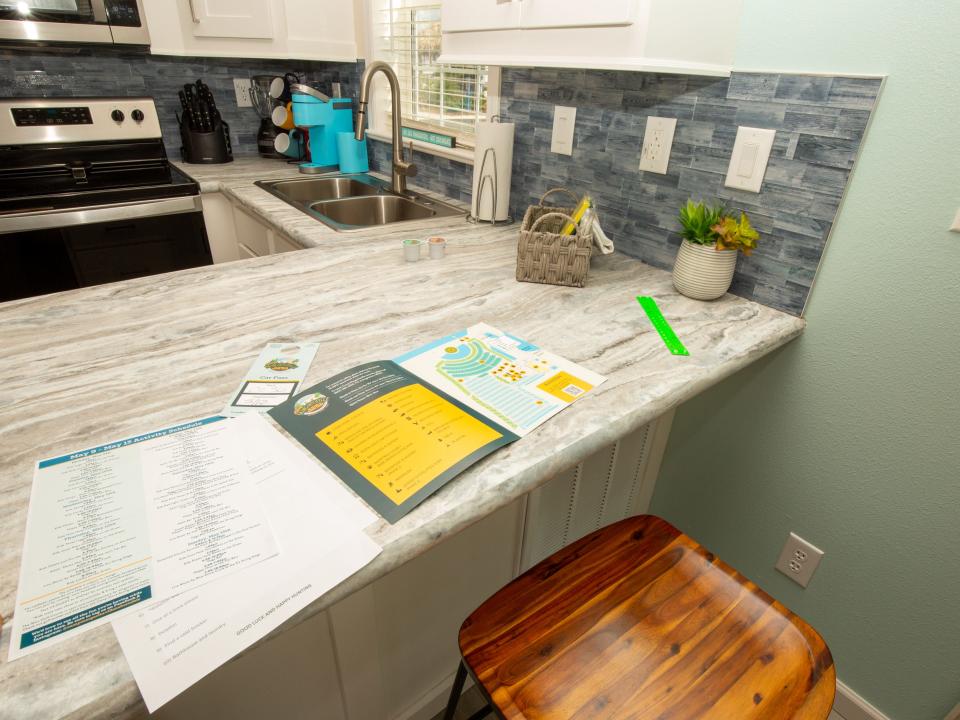 Pamphlets on a kitchen countertop.