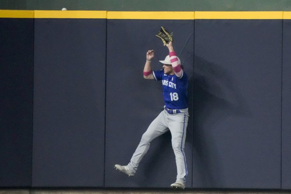 Kansas City Royals' Rusty Kuntz can't catch a three-run hom run hit by Milwaukee Brewers' Brice Turang during the third inning of a baseball game Sunday, May 14, 2023, in Milwaukee. (AP Photo/Morry Gash)