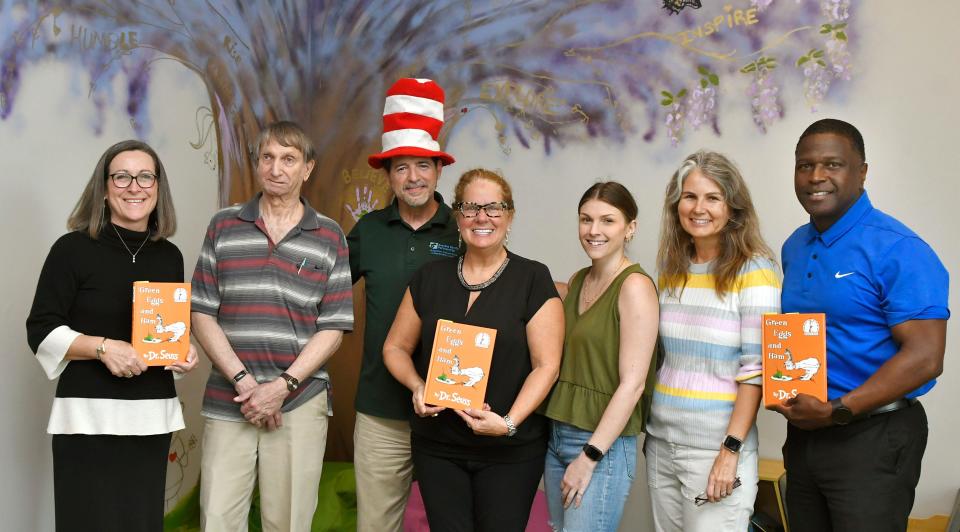 March is National Reading Month. To bring attention to the importance of reading, seven members of the community made a promotional video of them reading Dr. Seuss at the Early Learning Coalition of Brevard County, in Melbourne. Left to right, Johnette Gindling, President and CEO of Space Coast Health Foundation, Alan Bergman, Board Chair ELC, Phil Scarpelli, CEO Brevard Family Partnership, Laura Gambino, CEO of Early Learning Coalition of Brevard (ELC) , Caitlin Rice, Board Vice Chair ELC, Mara Bellaby, Executive Editor of Florida Today, and Michael Cadore of Eastern Florida State College. .There will also be a Dr. Seuss themed reading event at Family Promise of Brevard from 2-4 p.m. on Sunday, March 10.