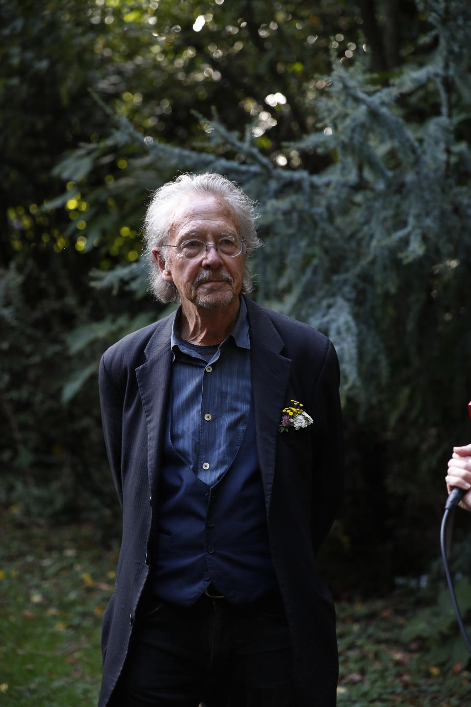 Austrian author Peter Handke poses for a photo at his house in Chaville near Paris, Thursday, Oct. 10, 2019. Handke was awarded the 2019 Nobel Prize in literature earlier Thursday. (AP Photo/Francois Mori)