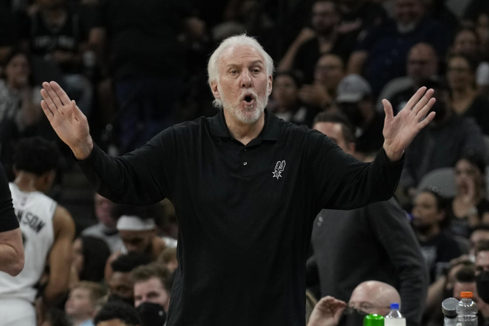 San Antonio Spurs head coach Gregg Popovich directs his team against the Milwaukee Bucks during the first half of an NBA basketball in San Antonio, Texas, Saturday, Oct. 23, 2021. (AP Photo/Chuck Burton)