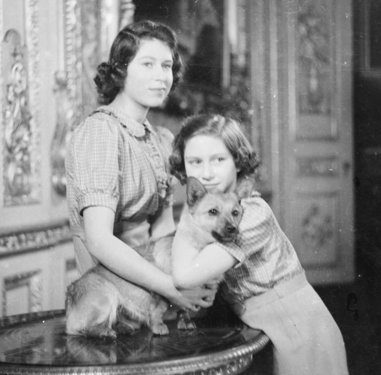 Princess Elizabeth and Princess Margaret with a Corgi (1941)