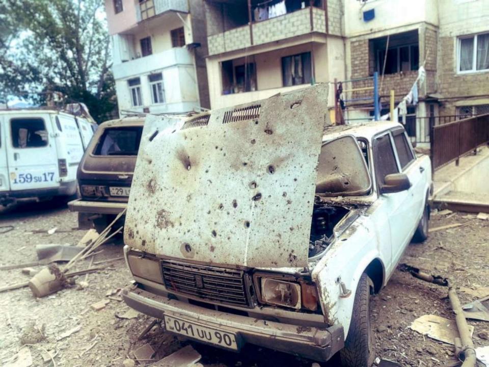 PHOTO: A view shows damaged cars in front of a residential building following the launch of a military operation by Azerbaijani armed forces in the city of Stepanakert in Nagorno-Karabakh, a region inhabited by ethnic Armenians, Sept. 19, 2023. (Siranush Sargsyan/pan Photo/via Reuters)