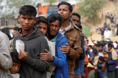 FILE PHOTO: Rohingya refugees line up for daily essentials distribution at Balukhali camp, near Cox's Bazar, Bangladesh January 15, 2018. REUTERS/Tyrone Siu