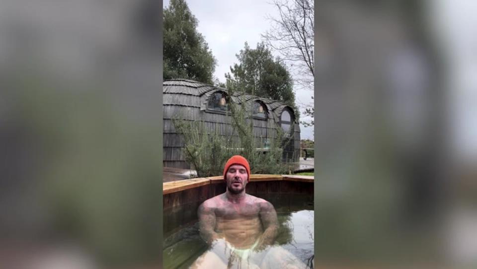 Sneaky peak: David in his plunge pool with a cheeky comment from his wife (David Beckham)