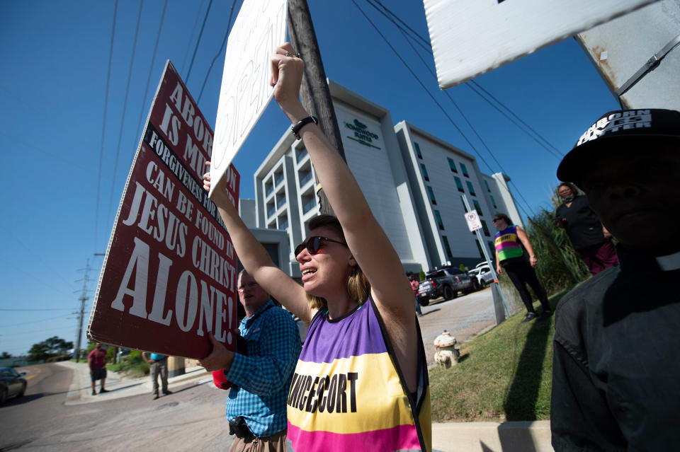 Anti-abortion protestors surround Ren Allen, center, an escort for the Jackson Women's Health Organization in Jackson, Miss., after the U.S. Supreme Court overturned Roe v. Wade on June 24, 2022.<span class="copyright">Barbara Gauntt—Clarion Ledger/USA TODAY NETWORK/Reuters</span>