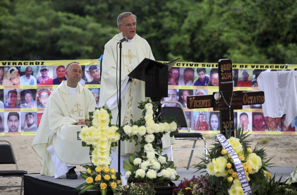 Reverend John I. Jenkins, rector of Notre Dame University, celebrates Mass in honor of disappeared people and the families in search of them in Colinas de Santa Fe, Mexico, Monday, Oct. 15, 2018, where almost 300 human remains were found in clandestine graves. The Mass was held one day before the women's Solecito Collective is to be honored by Notre Dame for its work locating the remains of missing people in Veracruz state. The Solecito Collective is made up people searching for their missing loved ones. (AP Photo/Felix Marquez)