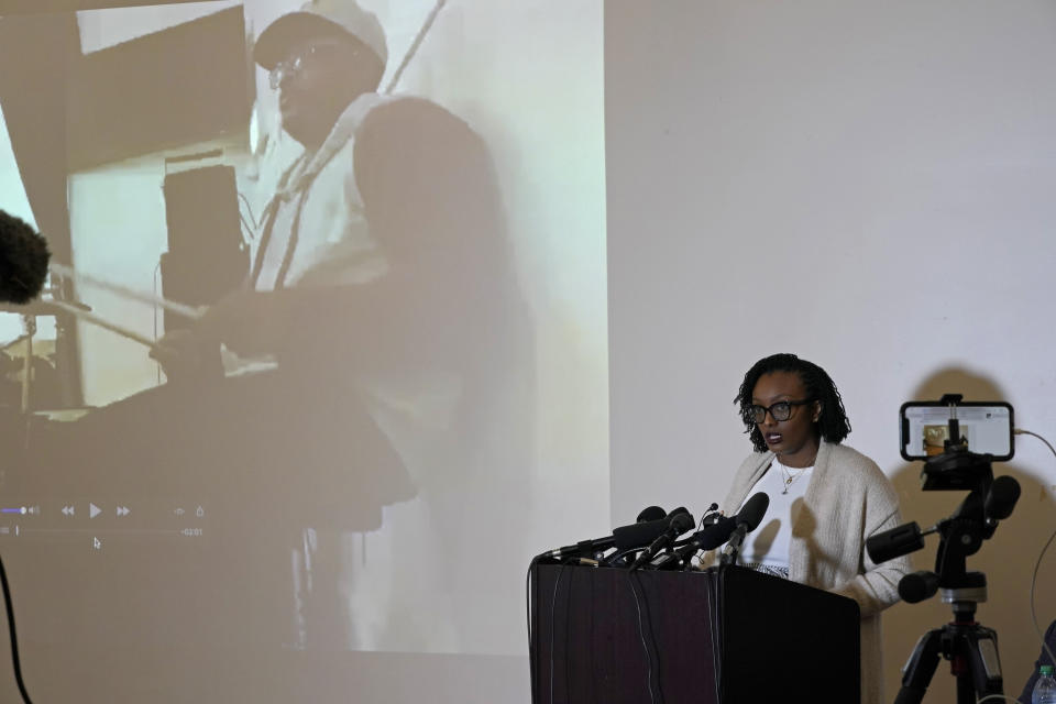 FILE - Monet Carter-Mixon, the sister of Manuel "Manny" Ellis, stands next to an image of her brother playing drums in church as she speaks Thursday, May 27, 2021, at a news conference in Tacoma, Wash., south of Seattle.A jury cleared three Washington state police officers of all criminal charges Thursday, Dec. 21, 2023 in the 2020 death of Manuel Ellis, a Black man who was shocked, beaten and restrained face down on a Tacoma sidewalk as he pleaded for breath..(AP Photo/Ted S. Warren,File)