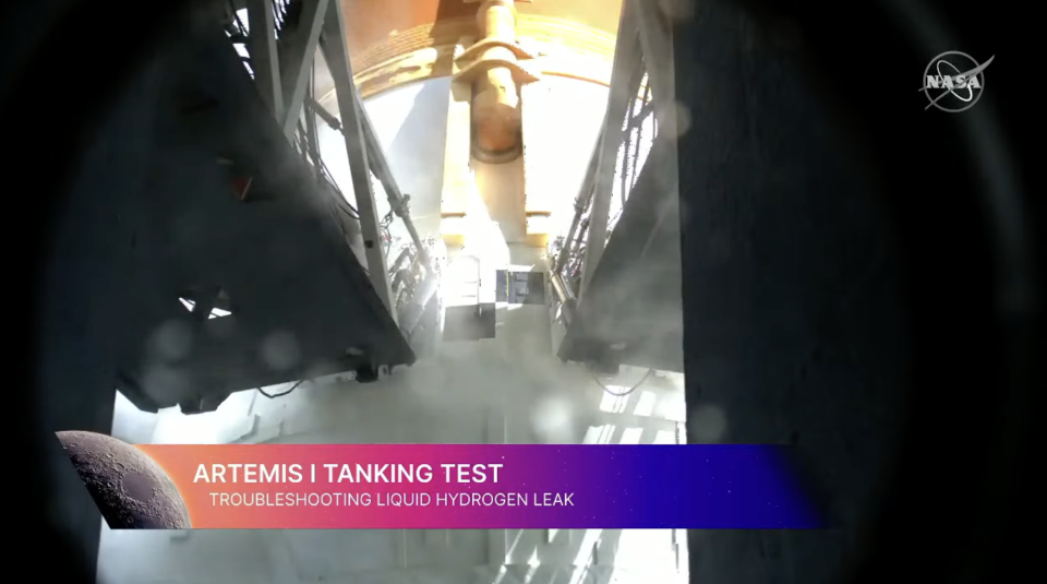 A screenshot of the umbilicals leading into the Space Launch System rocket at Kennedy Space Center. The hydrogen loading umbilical has been problematic.