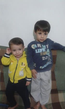Aylan Kurdi (L) and his brother Galip pose in an undated photo provided by the Kurdi family. REUTERS/Kurdi family/Handout via Reuters