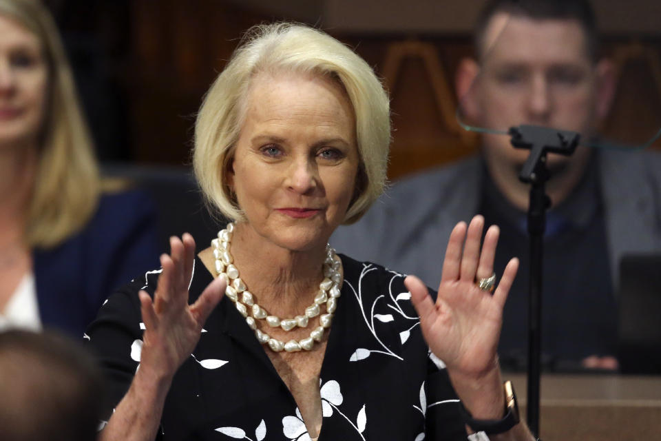 FILE - In this Jan. 13, 2020, file photo Cindy McCain, wife of former Arizona Sen. John McCain, waves to the crowd after being acknowledged by Arizona Republican Gov. Doug Ducey during his State of the State address on the opening day of the legislative session at the Capitol in Phoenix. Cindy McCain is going to bat for Joe Biden, lending her voice to a video set to air on Tuesday, Aug. 18, during the Democratic National Convention programming focused on Biden’s close friendship with her late husband, Sen. John McCain. (AP Photo/Ross D. Franklin, File)