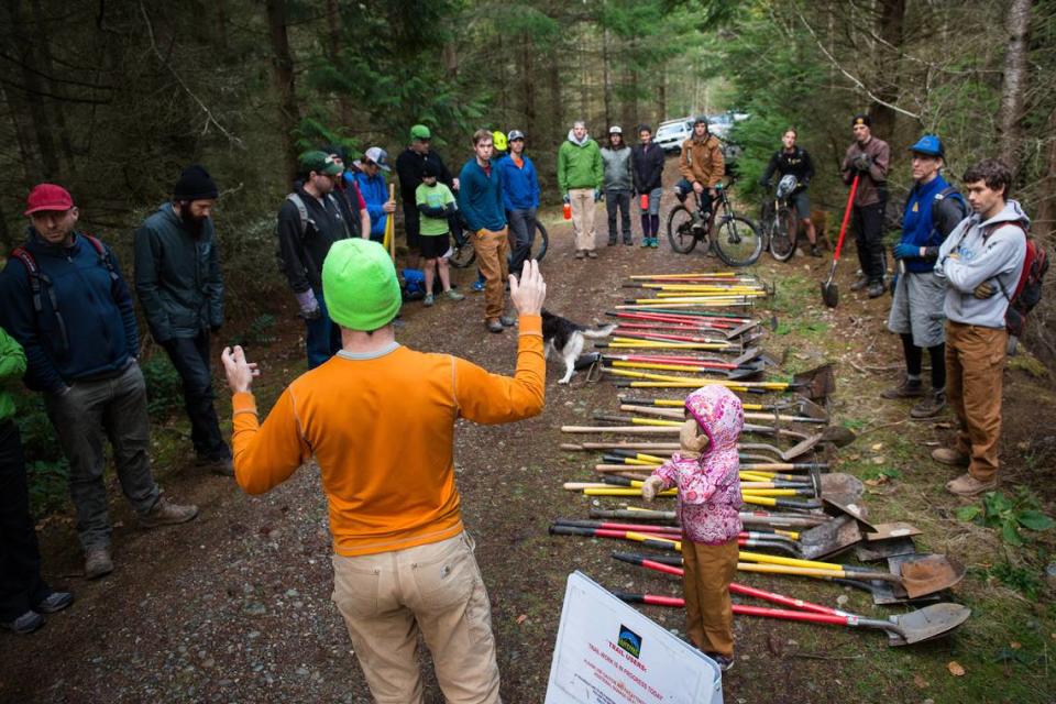 Volunteers organized by the Whatcom Mountain Bike Coalition prepare for work on the SST Trail in 2016 on Bellingham’s Galbraith Mountain.