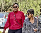 Ahmaud Arbery's mother Wanda Cooper-Jones walks towards the Glynn County Courthouse in Brunswick, Ga on Monday, Oct. 18, 2021. Jury selection got underway with hundreds of people ordered to report for what could be a long, laborious effort to find jurors to hear the trial of three white men charged with fatally shooting Ahmaud Arbery as he was running in their neighborhood. (AP Photo/Lewis M. Levine)