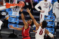 Texas Tech guard Terrence Shannon Jr. (1) shoots in front of Arkansas forward Justin Smith (0) in the first half of a second-round game in the NCAA men's college basketball tournament at Hinkle Fieldhouse in Indianapolis, Sunday, March 21, 2021. (AP Photo/Michael Conroy)