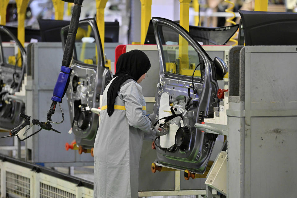 A female worker assembles vehicle parts on a production line inside Renault factory, on the outskirts of Tangier, Morocco, Monday, April 29, 2024. Morocco has grown its automotive industry from virtually non-existent to Africa’s largest in less than two decades. The North African kingdom supplies more cars to Europe than China, India or Japan, and has the capacity to produce 700,000 vehicles a year. (AP Photo)