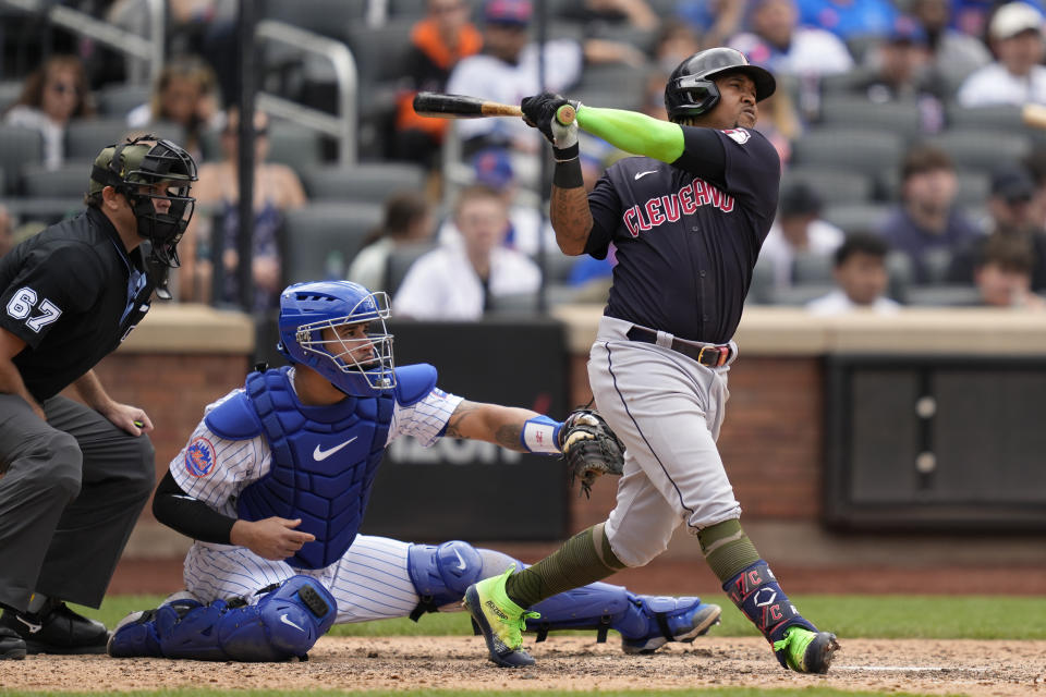 Cleveland Guardians' Jose Ramirez hits a go-ahead two-run home run off New York Mets relief pitcher David Robertson in the eighth inning of the opener of a split doubleheader baseball game, Sunday, May 21, 2023, in New York. (AP Photo/John Minchillo)