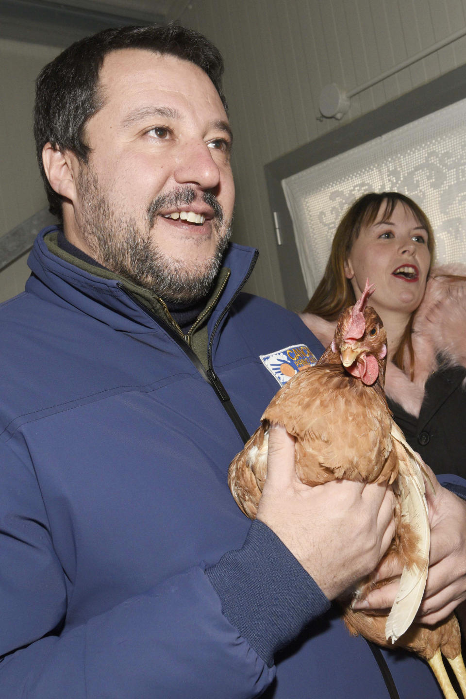 In this photo taken on Jan 13, 2020, the League's leader Matteo Salvini, holds a hen as he visit a chicken farm in Berceto, near Parma, Italy. The right-wing populist leader is campaigning hard for his League to take control of the wealthy northern region that has been a left-wing stronghold since World War II. (Stefano Cavicchi/LaPresse via AP)