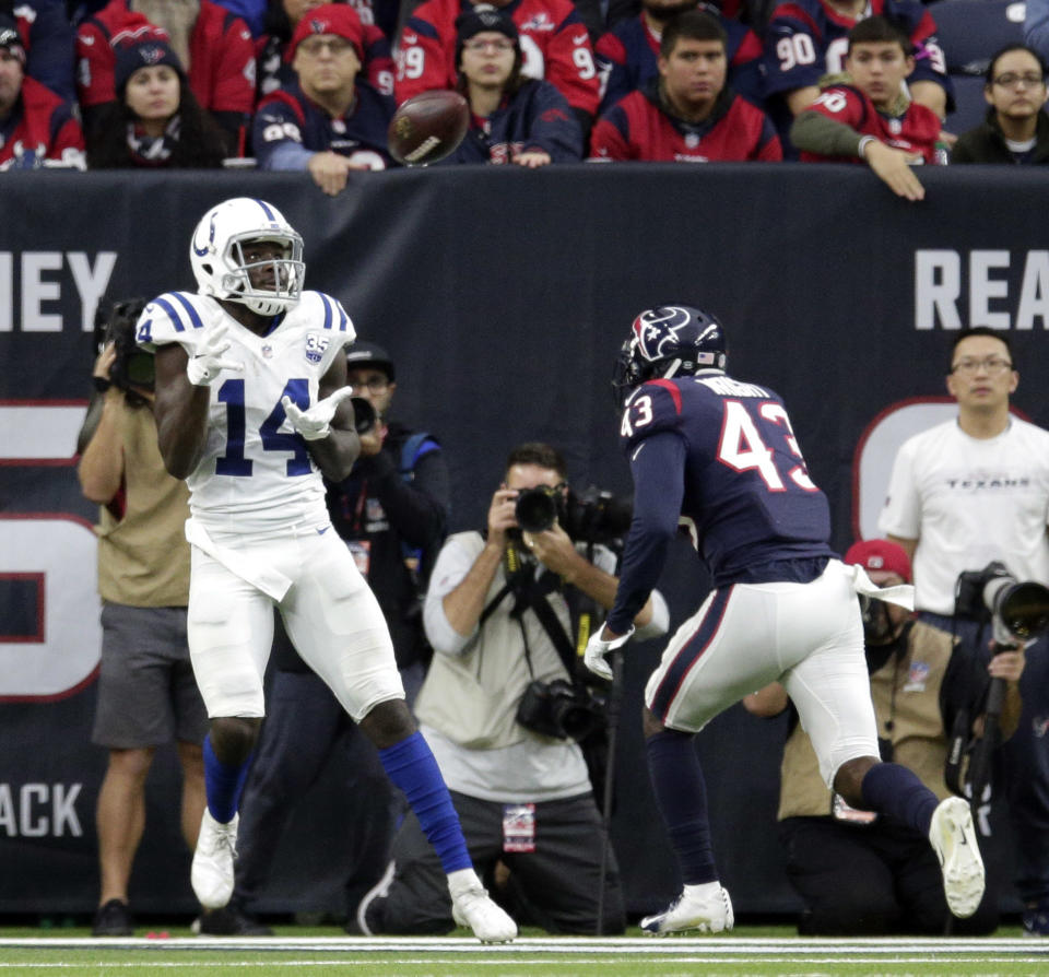 Indianapolis Colts wide receiver Zach Pascal (14) makes a touchdown catch as Houston Texans defensive back Shareece Wright (43) defends during the second half of an NFL football game Sunday, Dec. 9, 2018, in Houston. (AP Photo/Michael Wyke)