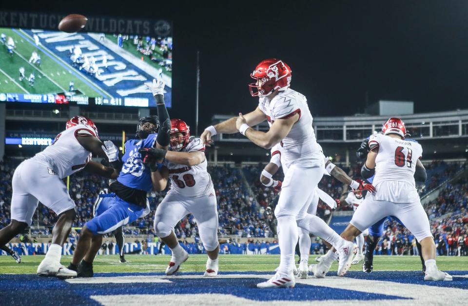 Louisville quarterback Brock Domann (19) passes under pressure in the end zone during the Cards' loss to the Wildcats in the 2022 Governor's Cup game Saturday afternoon. Nov. 26, 2022