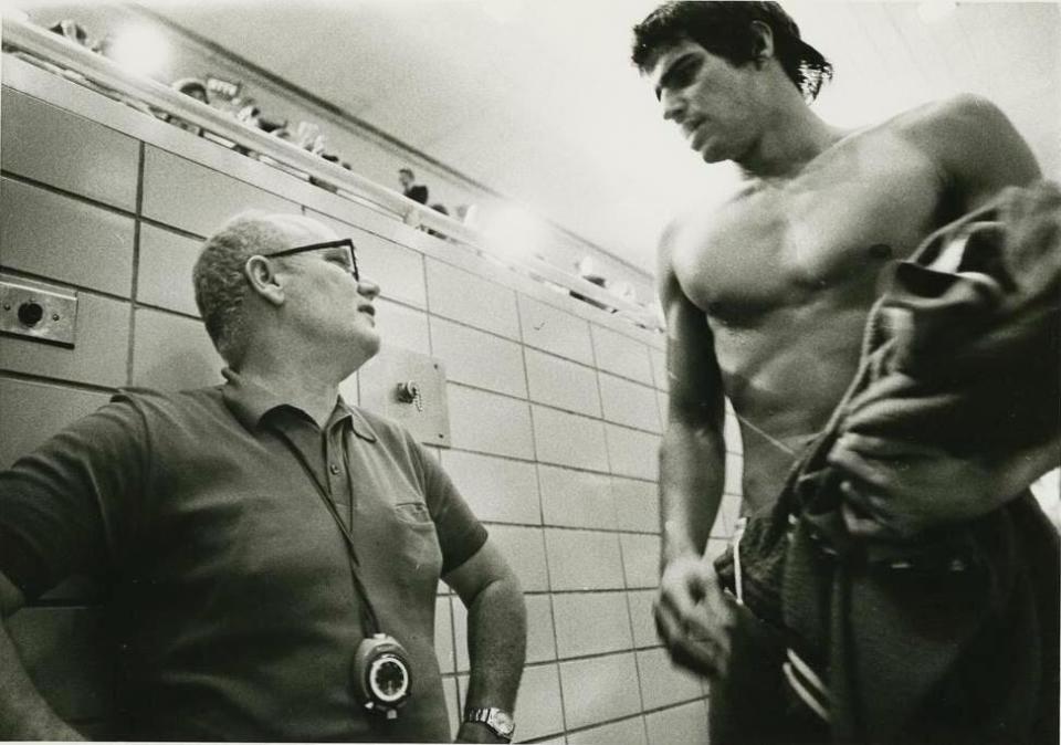 Indiana swim coach Doc Counsilman, left, talks with Mark Spitz, who was part of IU’s legendary 1970-71 team. (IU Archives photo)