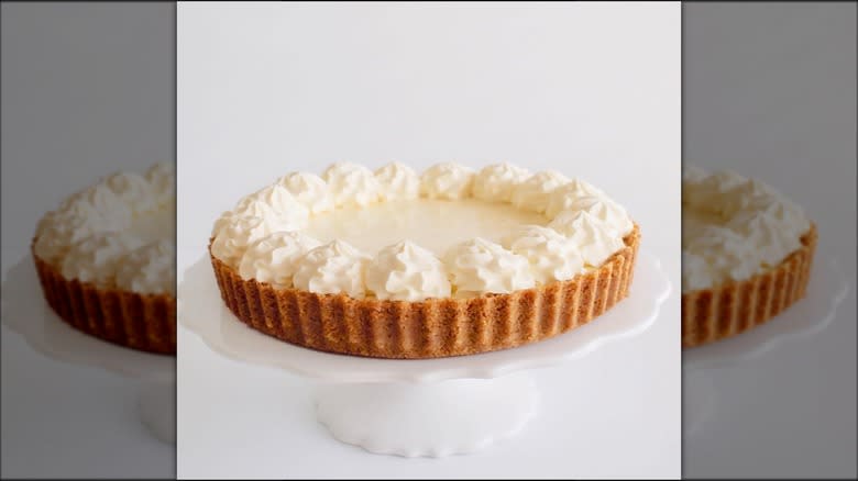 Lemon ice box pie on white cake stand