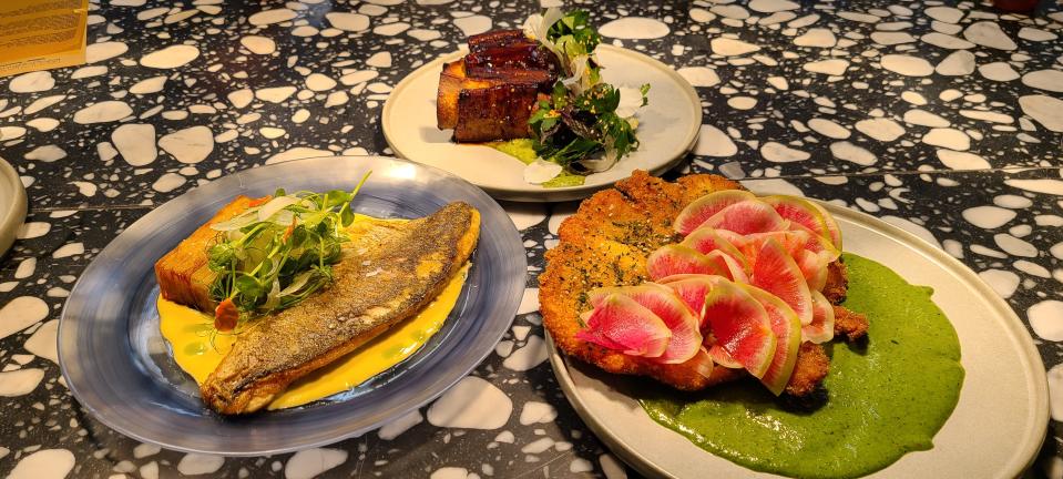 Bicyclette Cookshop's main courses include roasted branzino ($39), veal short ribs ($36) & chicken schnitzel ($25).